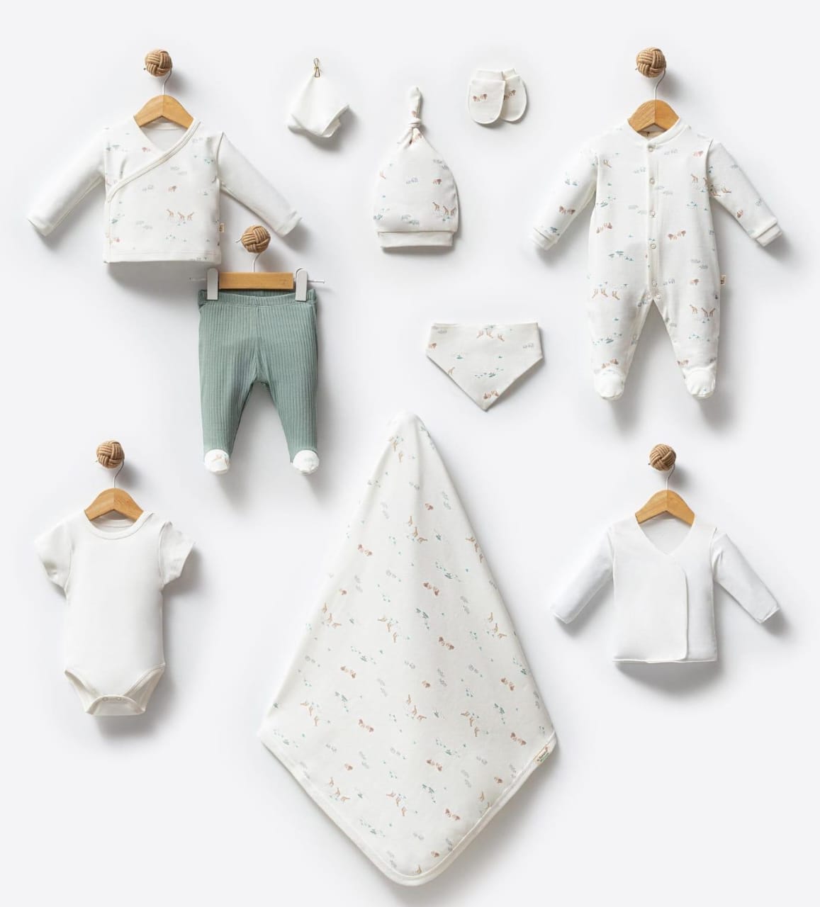 Collection of baby clothes and accessories on a white background