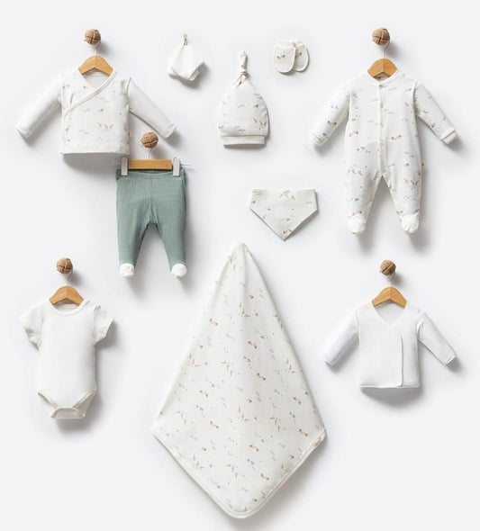 Collection of baby clothes and accessories on a white background