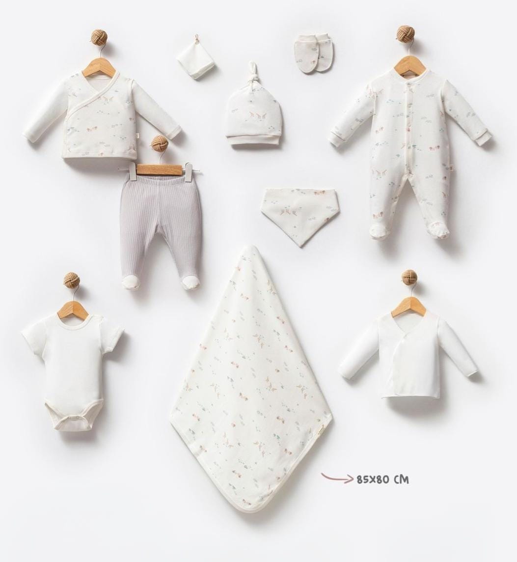 Collection of baby clothing and accessories on a white background